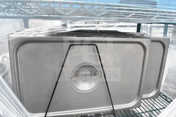 Green 5-tier wire shelving unit on commercial casters with drop-in bin lids. Buyer must dismantle. Consider freight.