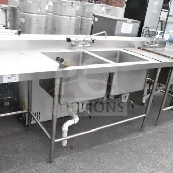 Commercial 2 bay stainless steel sink with extra right side sink bay; includes faucet and drain fittings, Aerospec label visible.