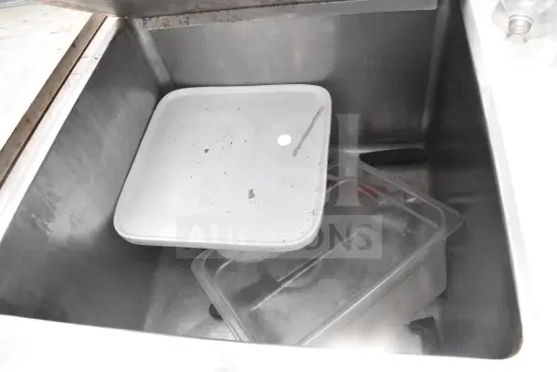 Commercial three-bay sink featuring stainless steel construction; includes an extra right side sink bay, in used condition.