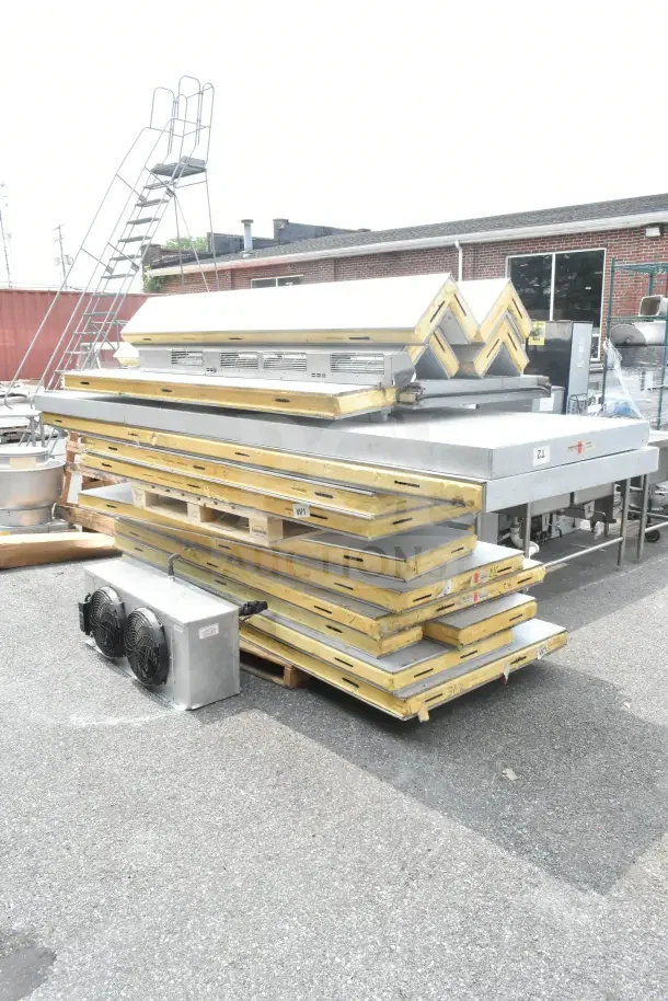 Walk In Box with Evaporator Fan. Includes insulated panels and dual fan unit. Appears in used condition, outdoor setting.