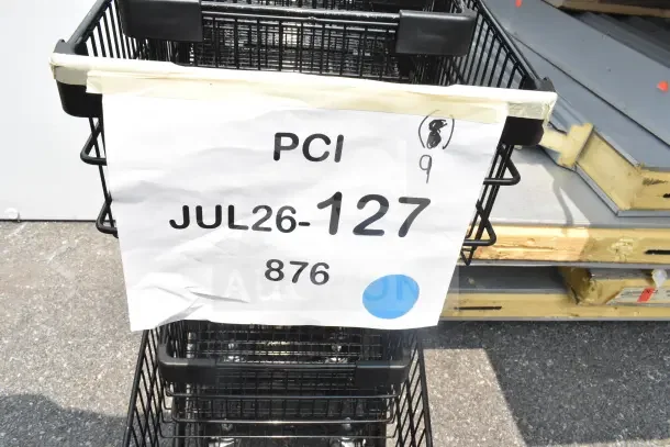 Regency 460SHPCRTTTB two-tier black shopping cart, 2.8 cu. ft., slightly dented, new. Marked "PCI JUL26-127".