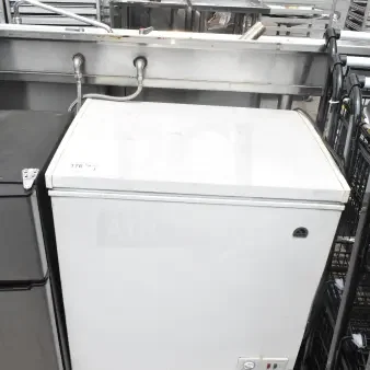 Igloo FRF520-SM chest freezer, 115 volts, 1 phase. White exterior, good condition, visible control panel.