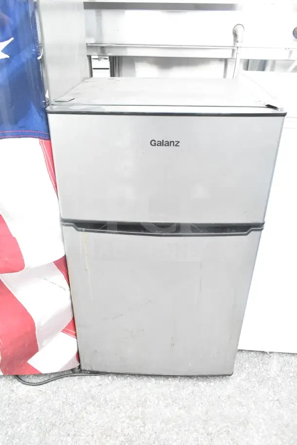 Galanz mini cooler, silver finish, visible wear, 115 volts, 1 phase. Part of a set of four including LG.
