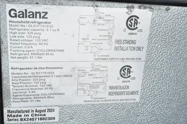 Four mini coolers including Galanz and LG, 115 volts, 1 phase. Galanz model GLR31TS1E02 label shows specs and installation.