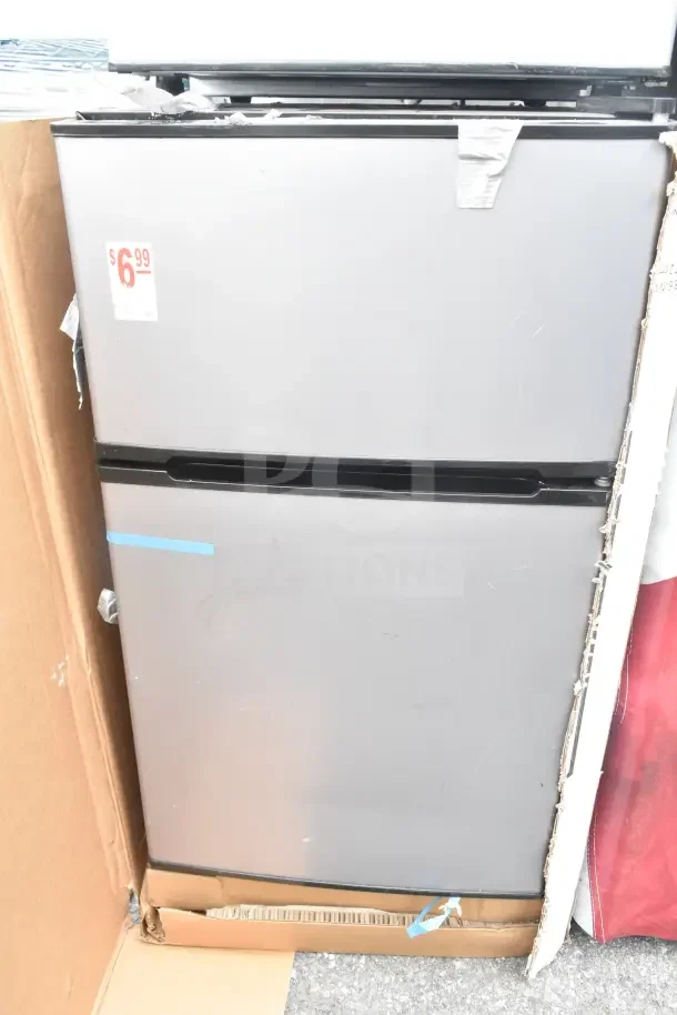 Four various mini coolers; brands include Galanz and LG. 115 volts, 1 phase, with visible wear and a $6.99 sticker.