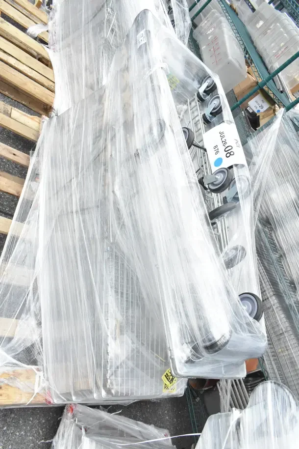 Brand new Regency supermarket shopping carts, scratch and dent condition, 6.3 cu. ft., wrapped in plastic, on pallets.