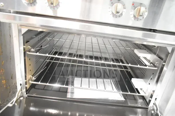 Brand new Cooking Performance Group ER36-240-1 electric range, 6 burners, 36", with standard oven, open door view.