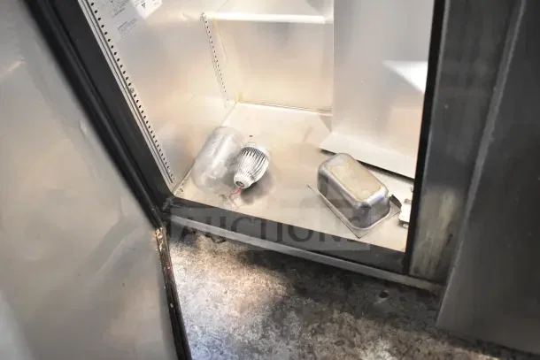 2018 True TSSU-72-30MB-ST-HC prep table interior, showing storage space and components. Item appears lightly used.