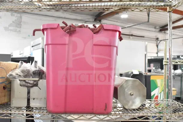 Metro shelving unit filled with contents including red poly bins, metal ware, and assorted items. Buyer must dismantle.