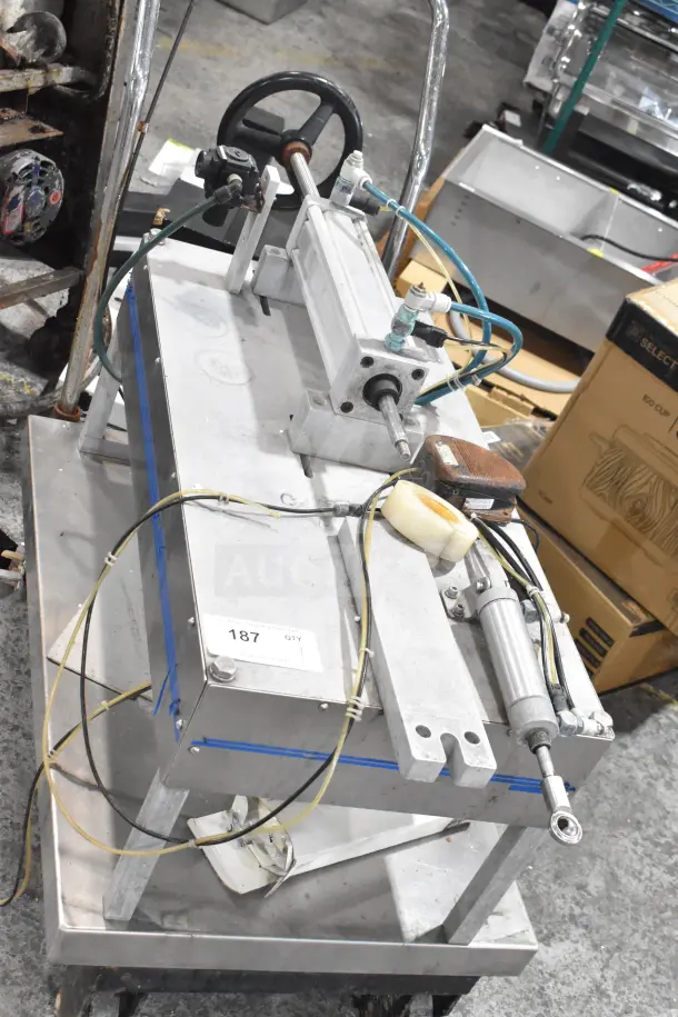 Geyer Portable System on commercial casters, features a metal frame, hydraulic components, hoses. Appears in used condition.