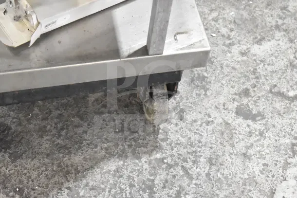 Geyer Portable System on commercial casters, showing metal frame and visible wear. Appears sturdy, used condition.