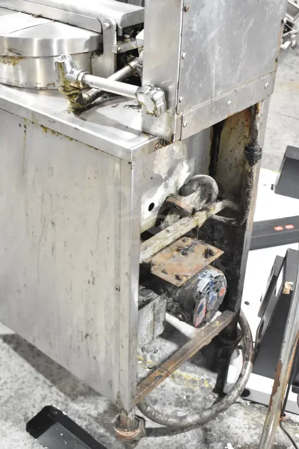 BK Industries commercial floor-style pressure fryer on casters; used condition with visible wear and grease residue.