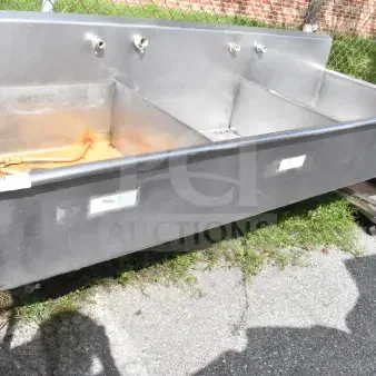 Commercial 3 bay sink, stainless steel, with faucets, mild rust and wear, dimensions approx. 6ft wide; ideal for kitchens.