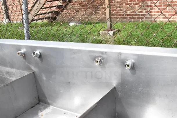 Commercial 3 bay sink, stainless steel, wall-mount faucets, durable construction, used condition with minor wear.