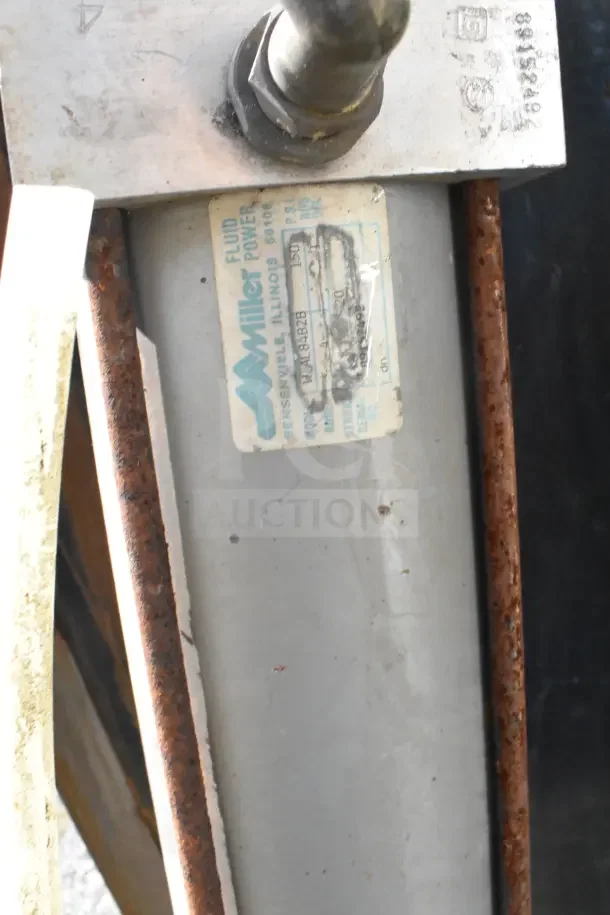 Miller W AL84B2B pneumatic cylinder, visible label detailing model, used condition with signs of wear, two items included.