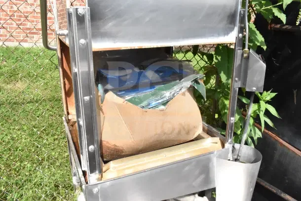 Jackson Conserver XL commercial pass-through dishwasher, visible wear, 115V, 1 Phase, metal frame, rust spots present.
