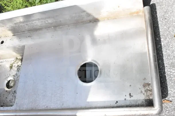 Commercial stainless steel right side dirty dishwasher table, missing legs, used condition, with drainage hole.
