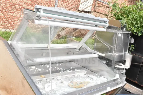 Commercial floor-style display case merchandiser with broken glass panels. Ideal for retail; needs repair.