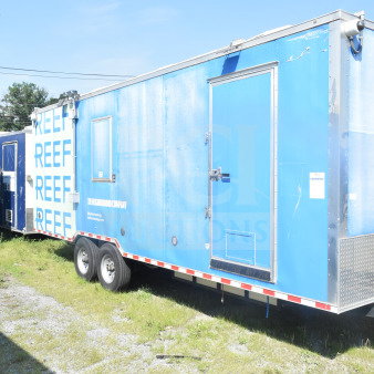 2021 Rock Solid Cargo 8.5'x24' blue food trailer with dual axles and side door, VIN 7H2BE2426MD037994, in good condition.
