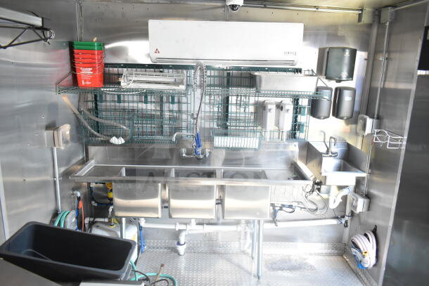 2021 Rock Solid Cargo 8.5'x24' food trailer interior; features stainless steel triple sink, storage racks, and Ventus AC unit. VIN: 7H2BE2426MD037994.
