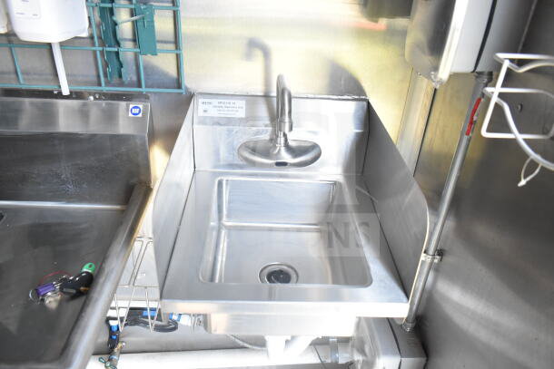 2021 Rock Solid Cargo 8.5'x24' food trailer interior, featuring a stainless steel hand sink with faucet, NSF label visible.