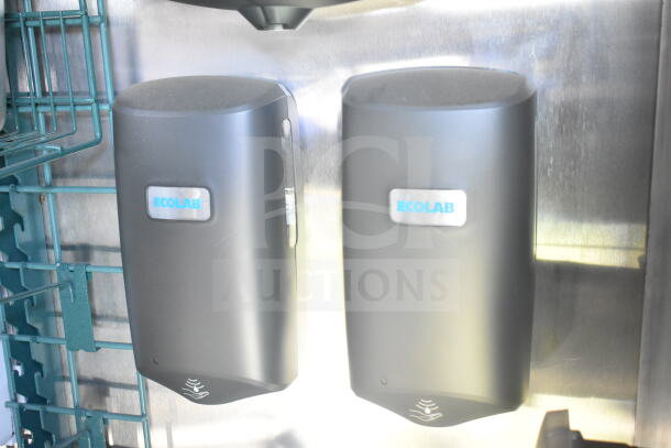 Ecolab dispensers mounted inside a Rock Solid Cargo food trailer.