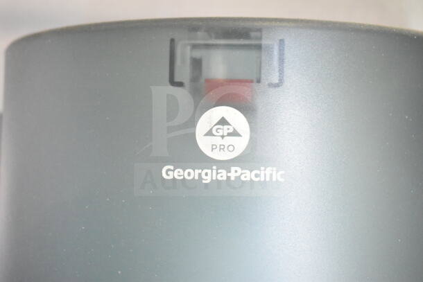 A Georgia-Pacific Pro sanitary dispenser with logo, featuring a visible window for monitoring supply levels.