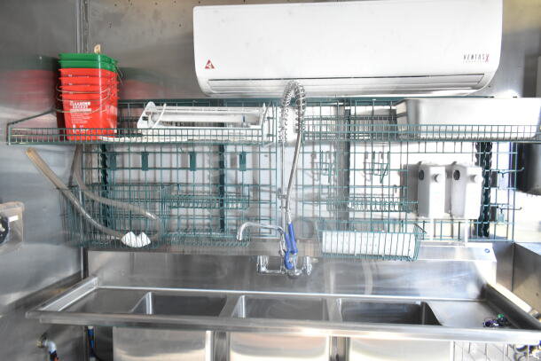 2021 Rock Solid Cargo 8.5'x24' food trailer interior, featuring sink, Ventus air unit, wire shelving, and cleaning supplies.