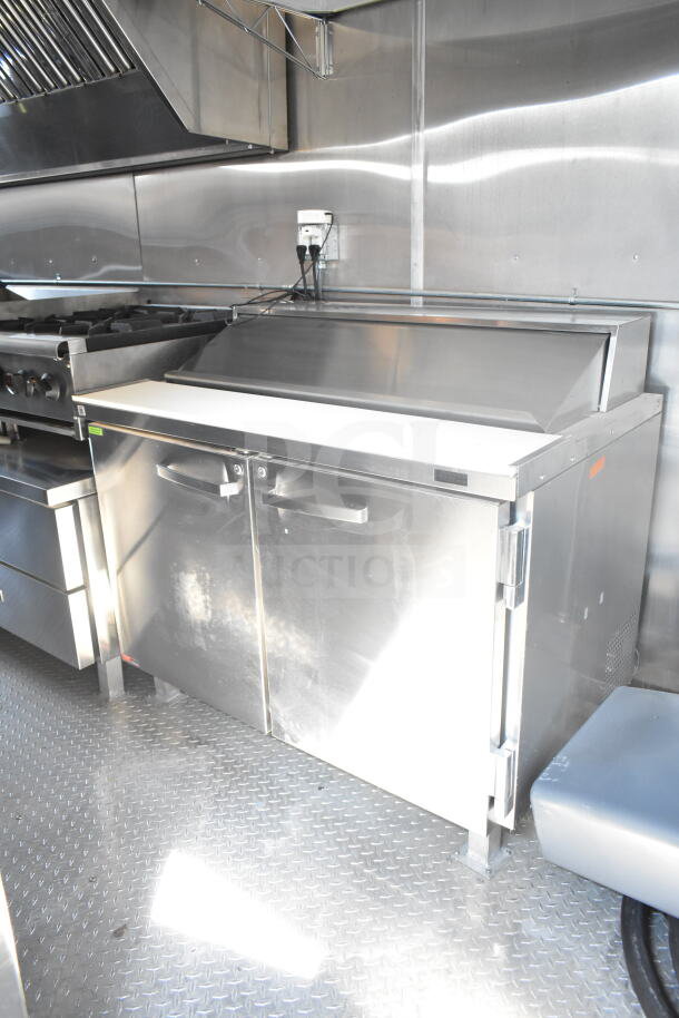 2021 Rock Solid Cargo 8.5'x24' food trailer interior with CaptiveAire grease hood, fire suppression, refrigeration, and Imperial gas fryers.