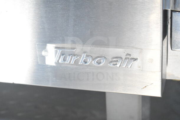 Turbo Air label on 2021 Rock Solid Cargo 8.5'x24' food trailer. Features CaptiveAire hood, fire suppression, Imperial fryers.