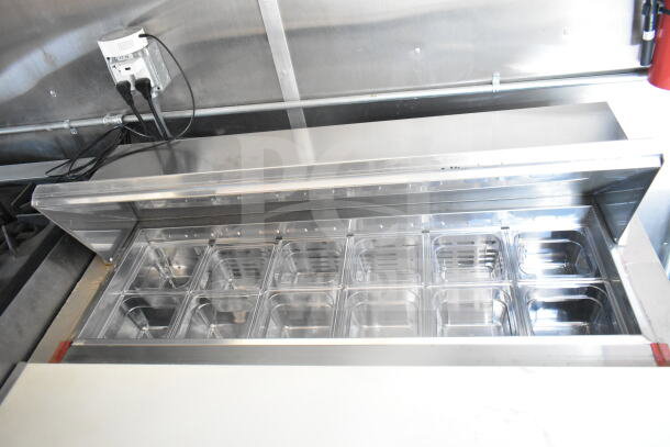 2021 Rock Solid Cargo 8.5'x24' food trailer, interior view showing refrigeration suite with multiple stainless steel bins.