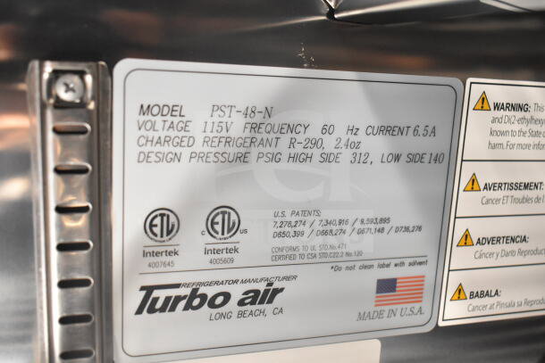 Label for Turbo Air refrigeration system in a 2021 Rock Solid Cargo food trailer. Model PST-48-N, 115V, R-290 refrigerant.