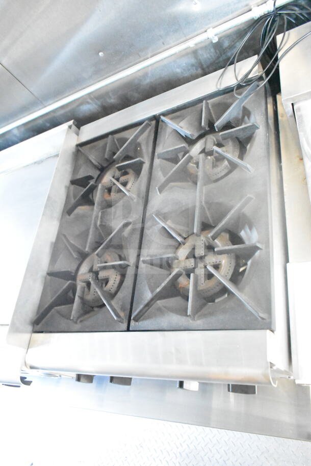 2021 Rock Solid Cargo 8.5'x24' food trailer's Imperial gas fryers with four-burner setup, part of kitchen suite.