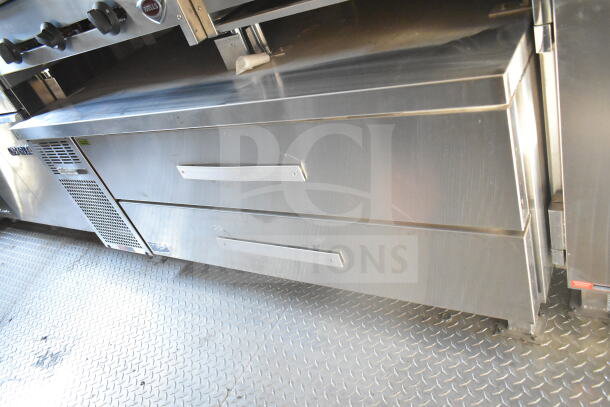 2021 Rock Solid Cargo 8.5'x24' food trailer interior, featuring stainless steel refrigeration suite and Imperial gas fryers.