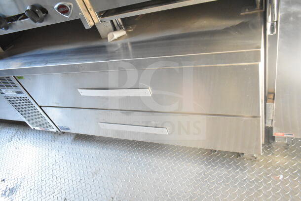 2021 Rock Solid Cargo 8.5'x24' food trailer interior, featuring a CaptiveAire grease hood and refrigeration suite.