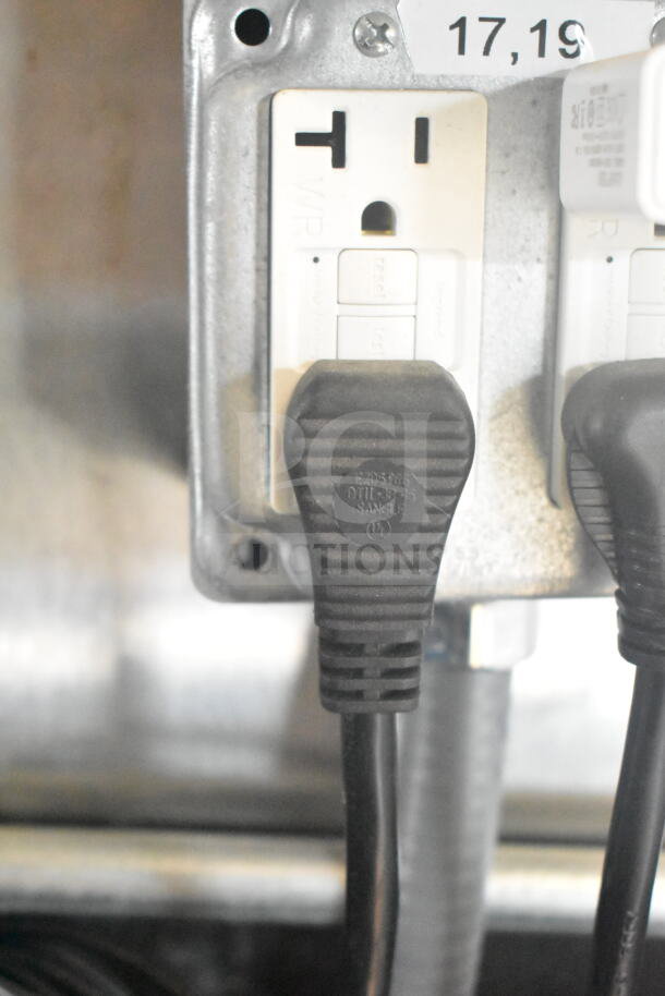 Power outlets inside 2021 Rock Solid Cargo food trailer, featuring CaptiveAire grease hood and fire suppression system.