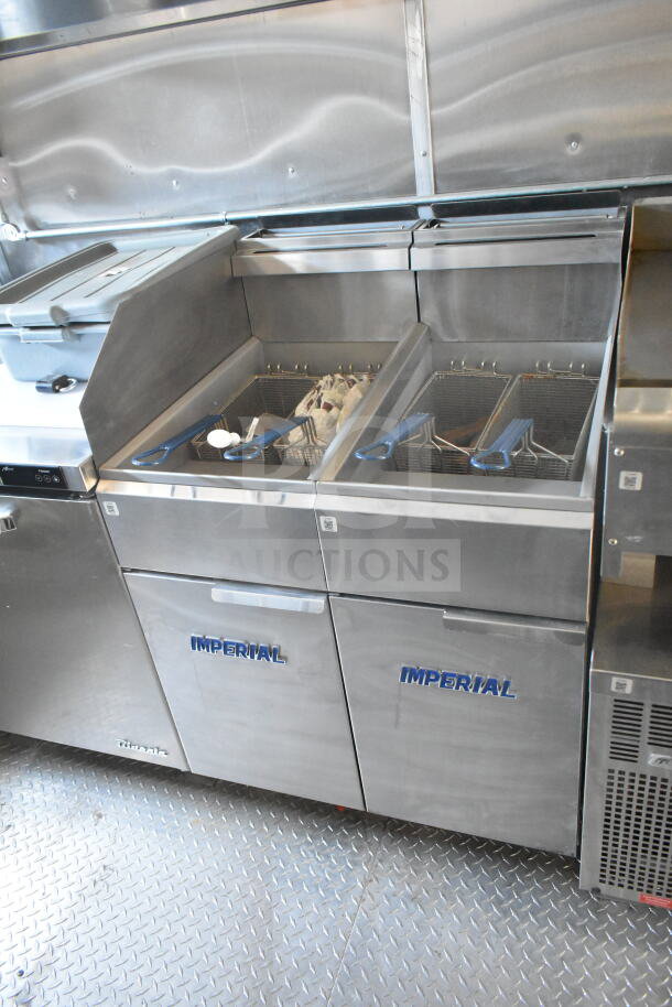 2021 Rock Solid Cargo 8.5'x24' food trailer with Imperial gas fryers, CaptiveAire grease hood, and refrigeration suite.