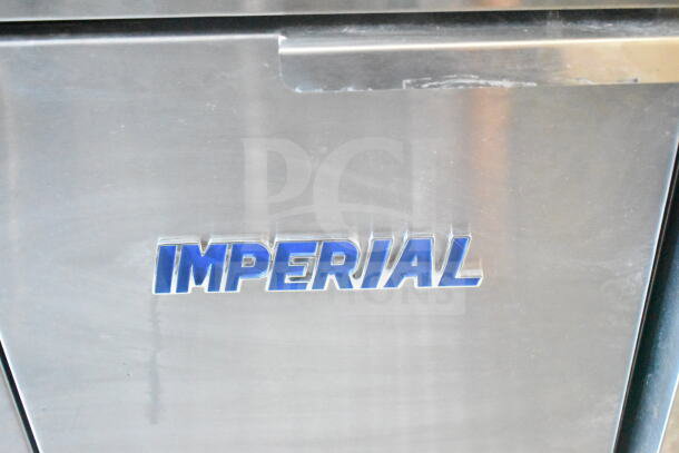 "Imperial" gas fryer logo on stainless steel surface within a 2021 Rock Solid Cargo 8.5'x24' food trailer.