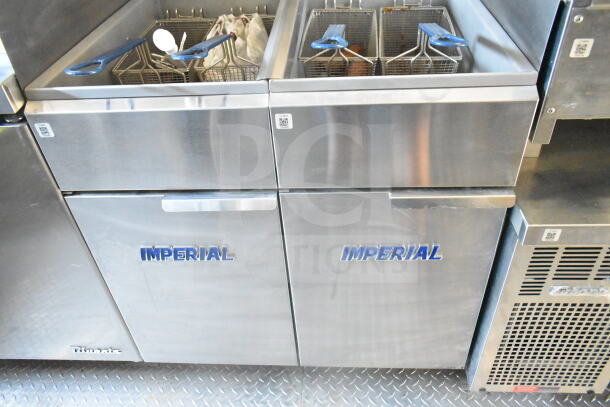2021 Rock Solid Cargo 8.5'x24' food trailer with Imperial gas fryers, visible grease hood, fire system, and refrigeration.