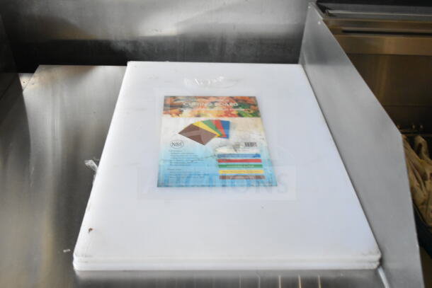 White cutting board inside 2021 Rock Solid Cargo food trailer, featuring CaptiveAire grease hood and Imperial gas fryers.