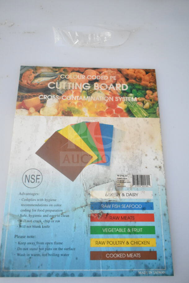 Colour-coded PE cutting board packaging featuring multiple board colors for cross-contamination prevention. NSF certified.