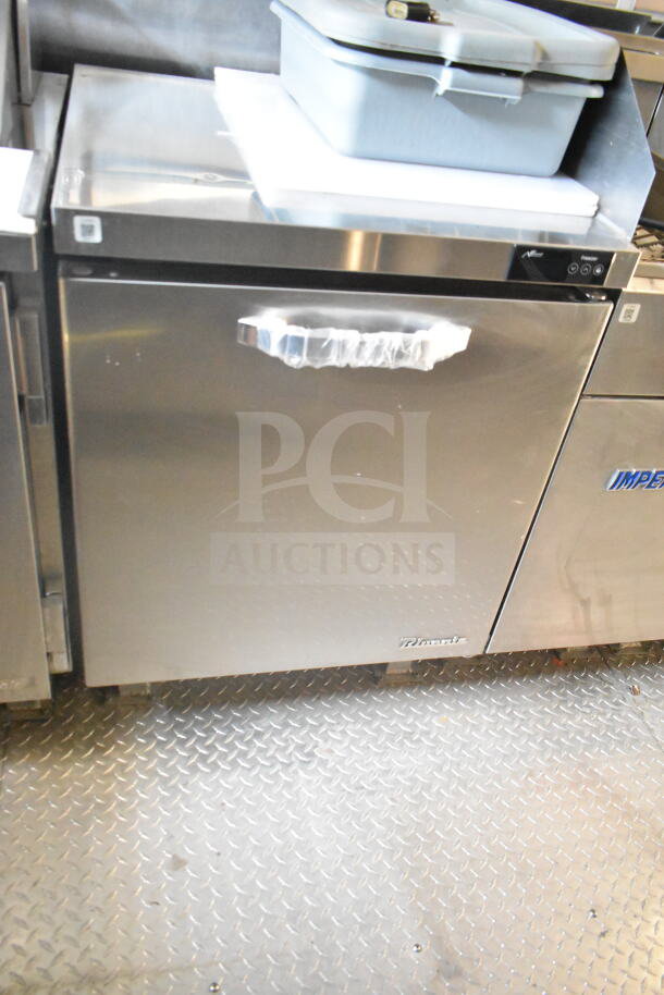 2021 Rock Solid Cargo 8.5'x24' food trailer interior showing refrigeration unit, stainless steel surface, and rubber mat floor.