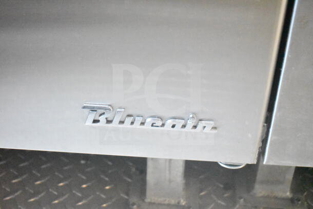 "Blueair logo on a refrigerated appliance in a 2021 Rock Solid Cargo 8.5'x24' food trailer, featuring CaptiveAire grease hood."