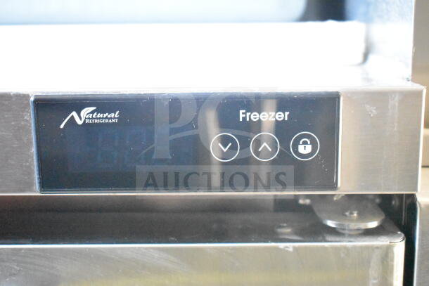 Control panel of a refrigeration suite in a 2021 Rock Solid Cargo food trailer, featuring Natural Refrigerant branding and freezer controls.