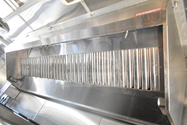 2021 Rock Solid Cargo 8.5'x24' food trailer interior showing CaptiveAire grease hood and fire suppression system.