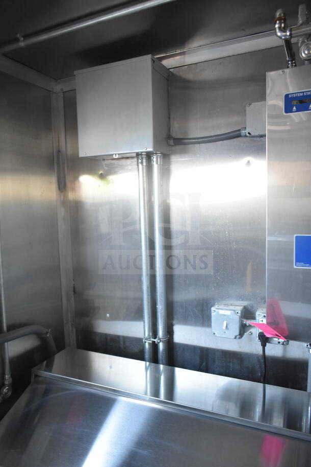 2021 Rock Solid Cargo 8.5'x24' food trailer interior with CaptiveAire grease hood, fire suppression system, and electrical wiring.