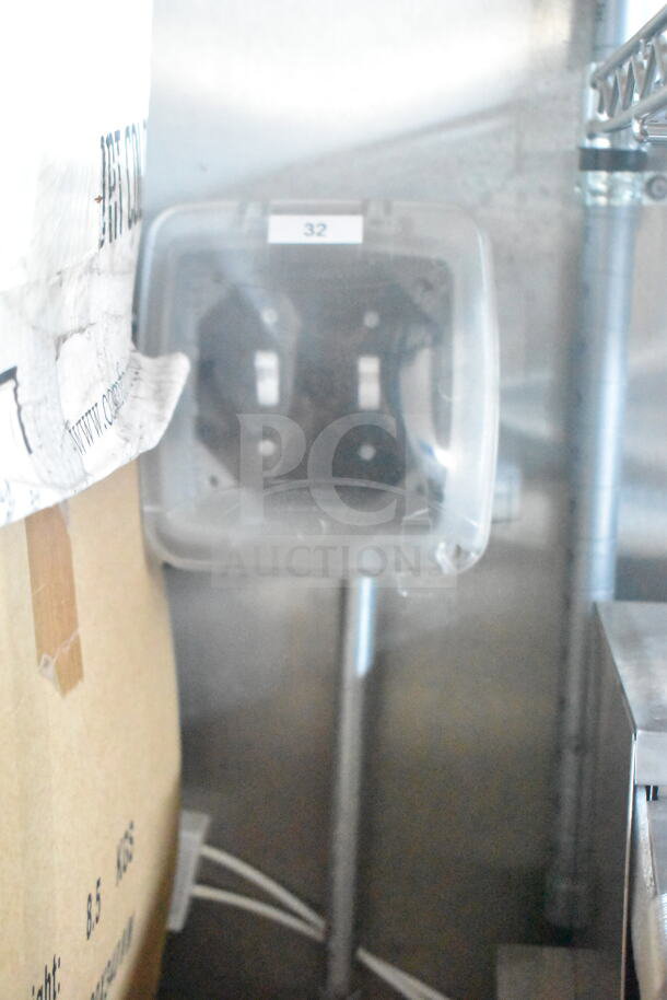 Interior view of a 2021 Rock Solid Cargo 8.5'x24' food trailer, showing part of the CaptiveAire grease hood. Visible piping and electrical components.
