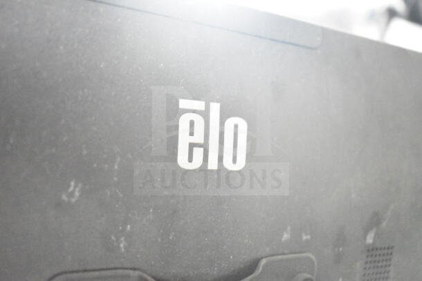 Close-up of "Elo" logo on a surface. Dusty finish, no visible details of the Rock Solid Cargo food trailer.