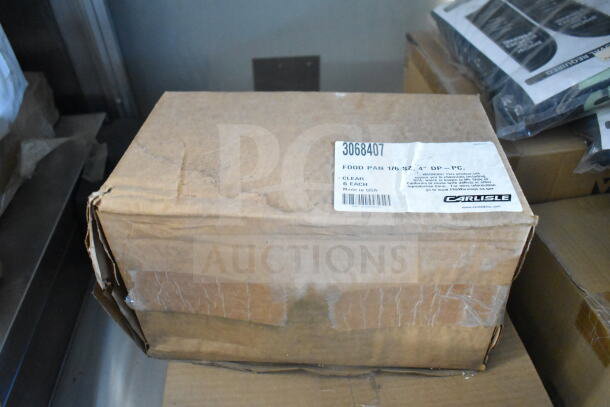 Cardboard box labeled "Carlisle" containing food pans, marked "Made in USA" with product number 3068407, 1/6 size, 4" deep.