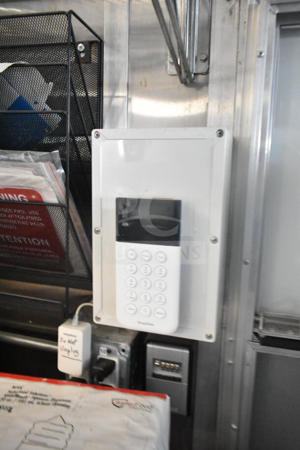Interior of 2021 Rock Solid Cargo 8.5'x24' food trailer featuring SmartBox control panel and electrical setup.